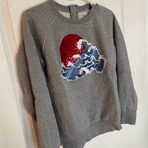 Emoji of a Wave Sweater from Germany